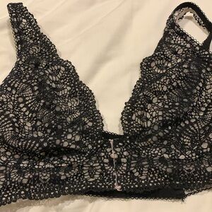 Victoria’s Secret front snap black lace bra L/G back is strappy.  Unworn.